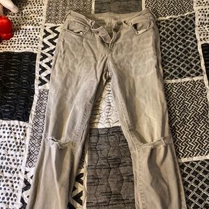 These are Old Navy grey mid rise skinny jeans with rips in the knees